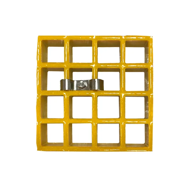 Small molded FRP grating panel on a white background with a metal clip fitted across two bars at one fixing point