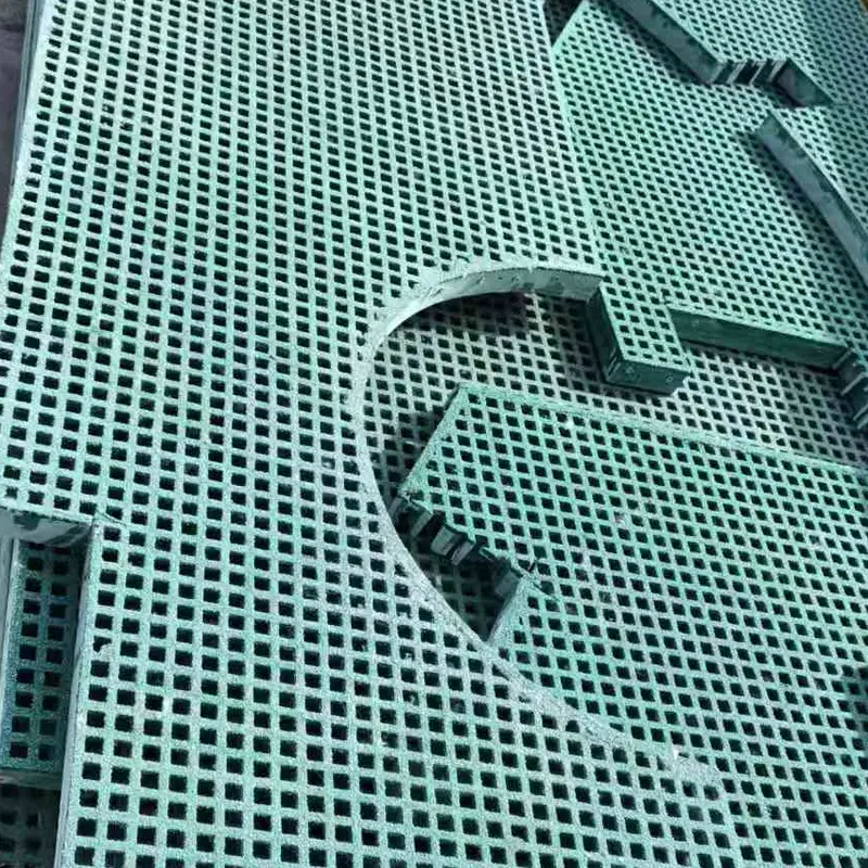 Close-up of a cut edge and opening in a green mini mesh FRP grating panel
