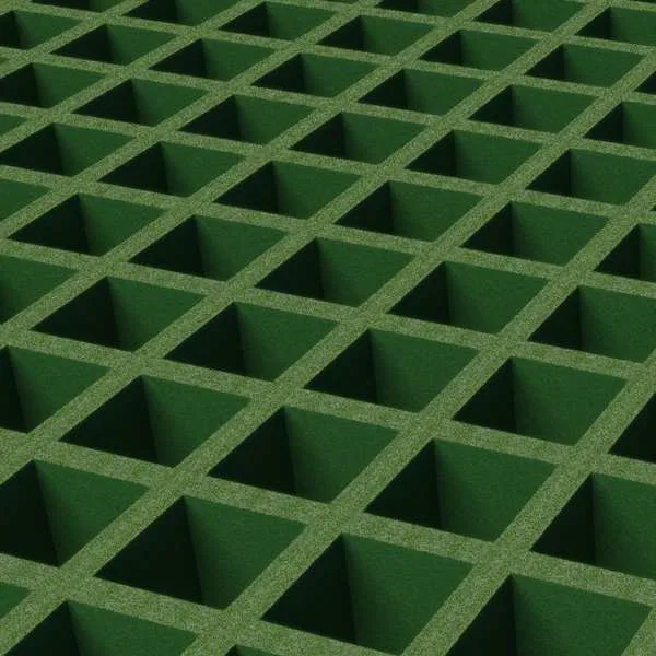 Close-up of a green molded FRP grating panel with a textured walking surface