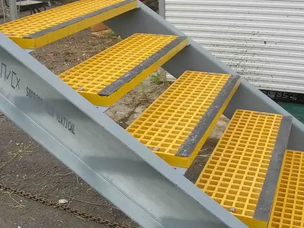 Yellow FRP grating treads fitted to an outdoor steel stair
