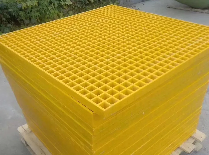 Stack of yellow molded FRP grating panels on a pallet