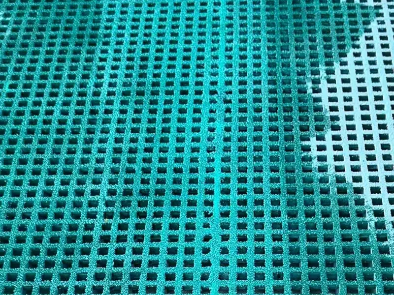 Green mini mesh FRP grating with small square openings and a textured surface
