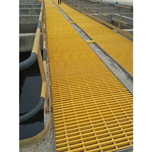 Yellow grating access panels along a water channel