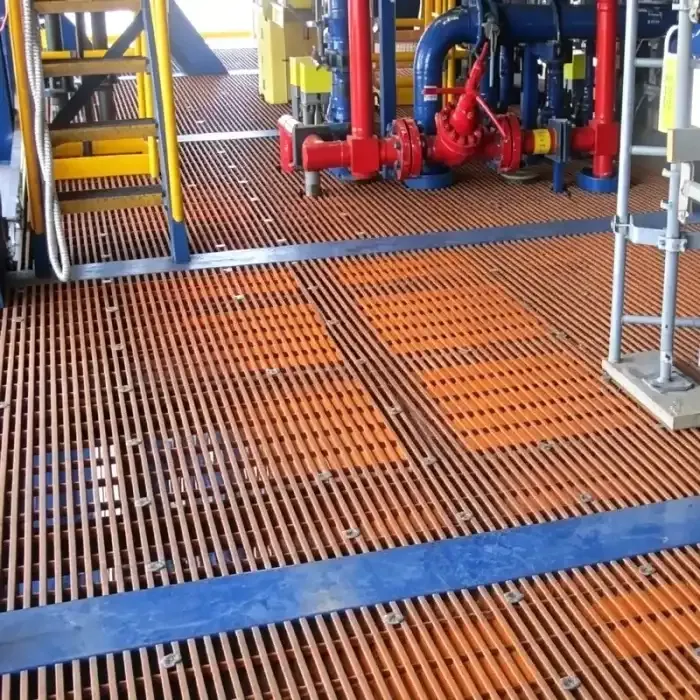 Orange grating floor around industrial pipework and equipment